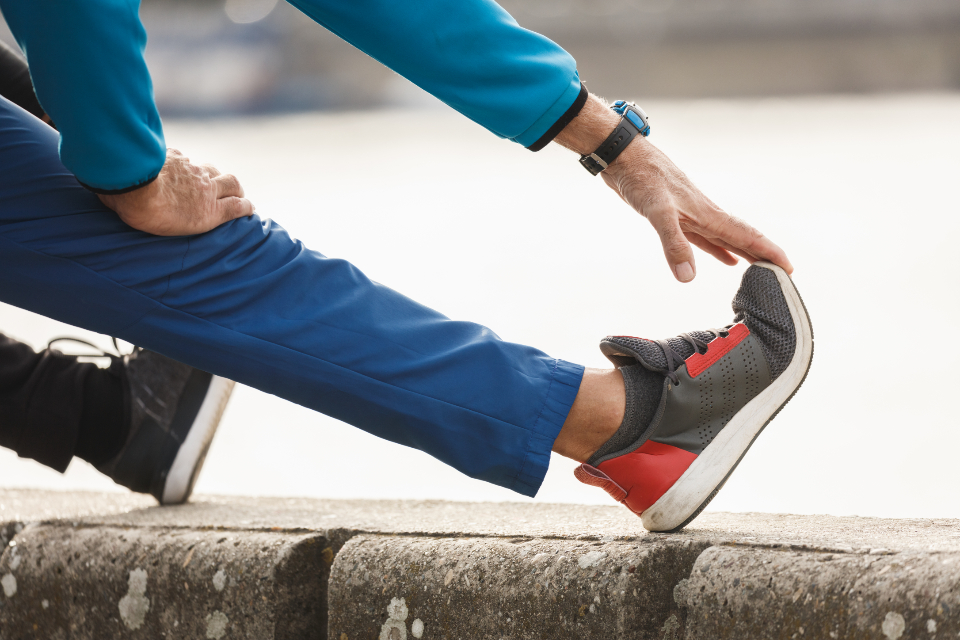 Close-up of a calf and ankle stretch in athletic wear