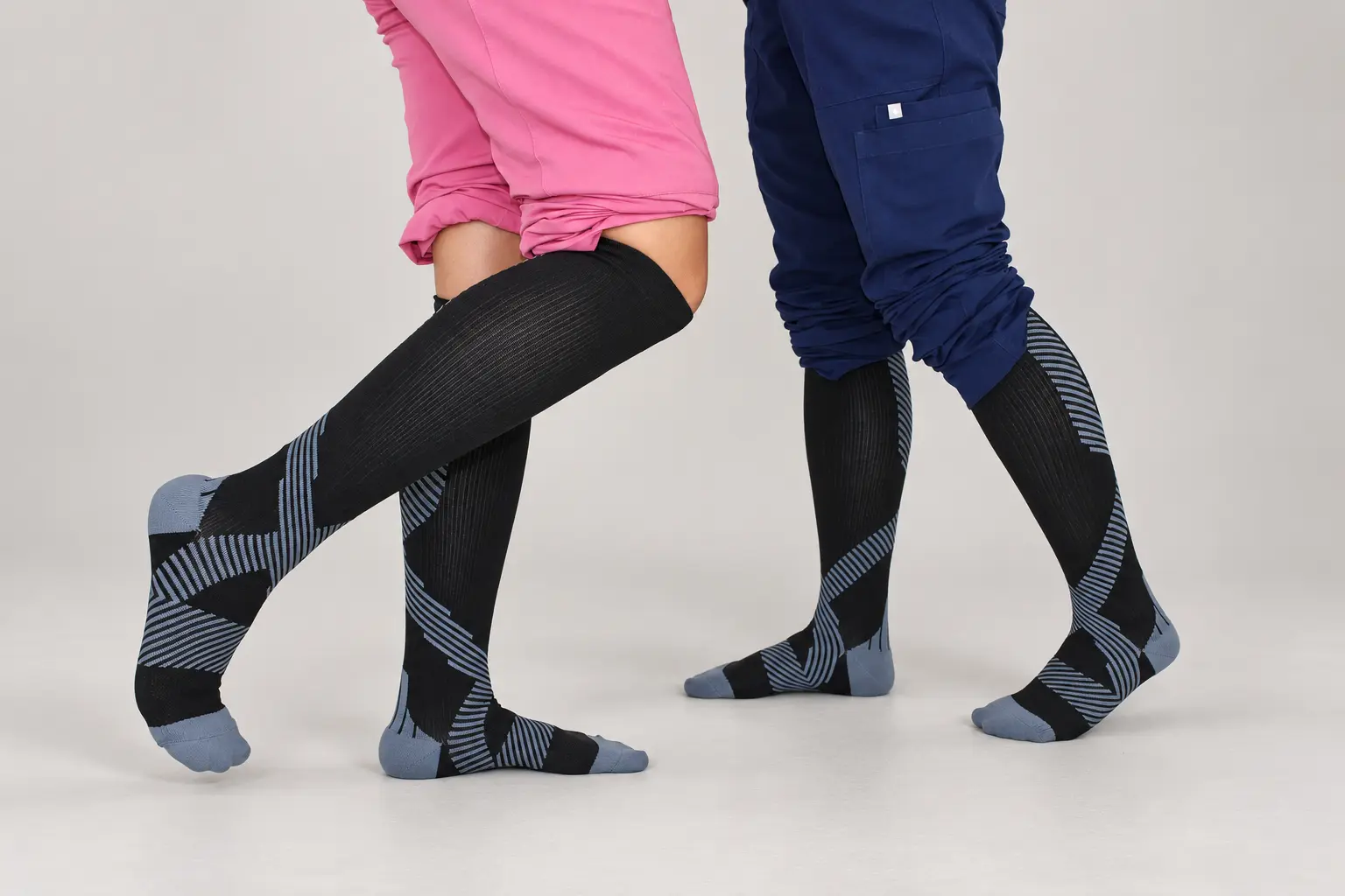Close-up of two nurses standing in NursingRx compression socks